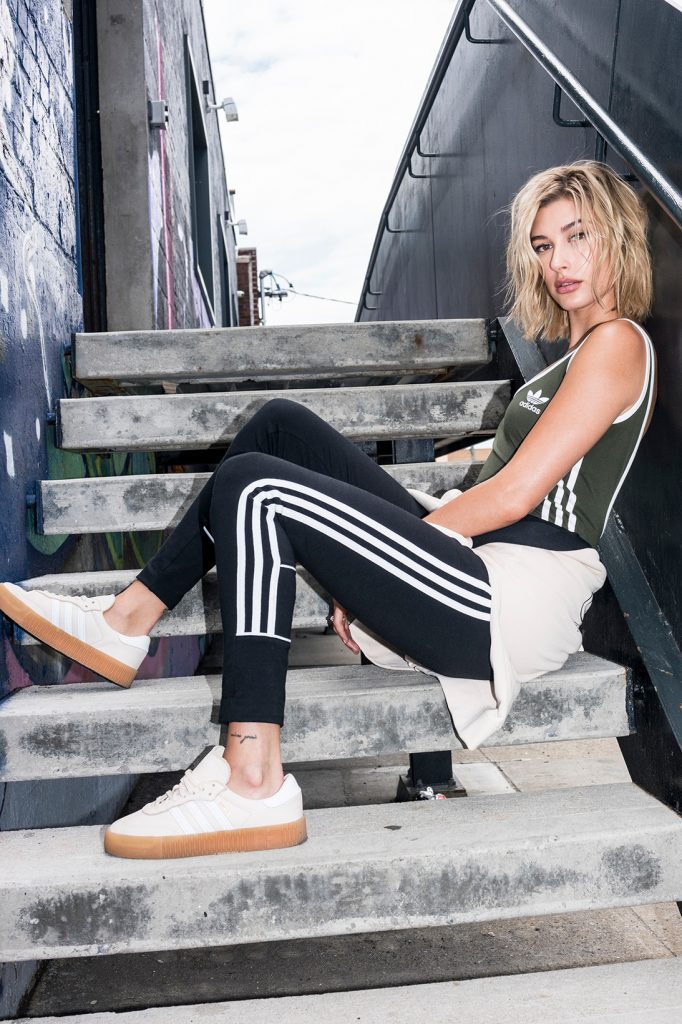 Hailey bieber wearing adidas suit modeling