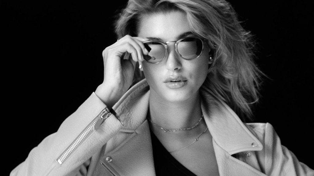 Hailey bieber wearing glasses background