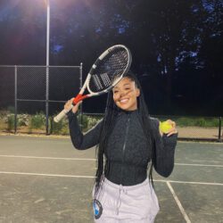 Playing tennis smiling
